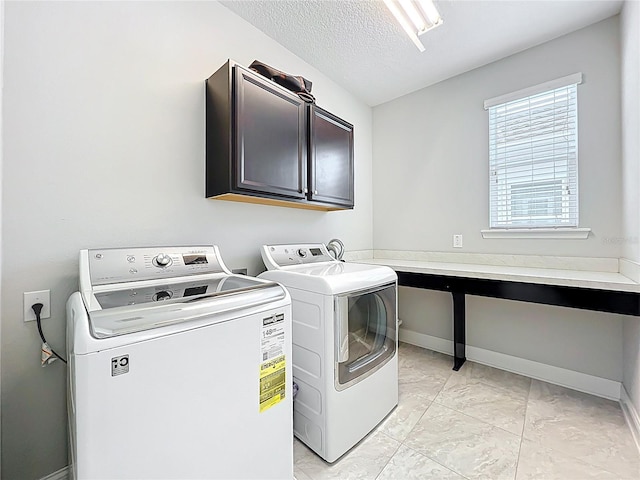 473 Oviedo Blvd, Oviedo, FL 32765 - washroom with cabinet space, washing machine and dryer, light marble finish flooring, baseboards, and a textured ceiling