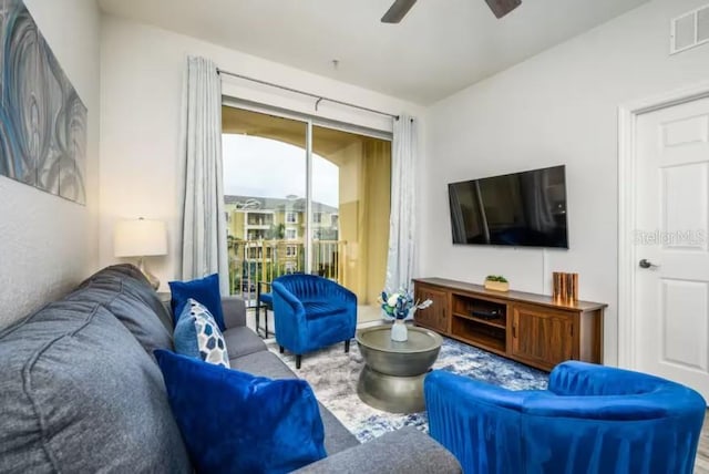 living area with a ceiling fan