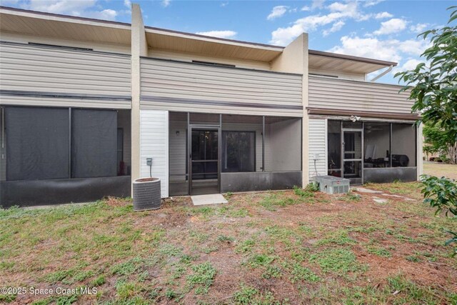 3164 Finsterwald Dr Unit 3164, Titusville, FL 32780 - back of property with a sunroom and cooling unit