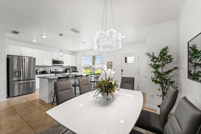 16162 Arbor Crest Aly, Winter Garden, FL 34787 - dining room featuring a chandelier, light tile patterned floors, and recessed lighting