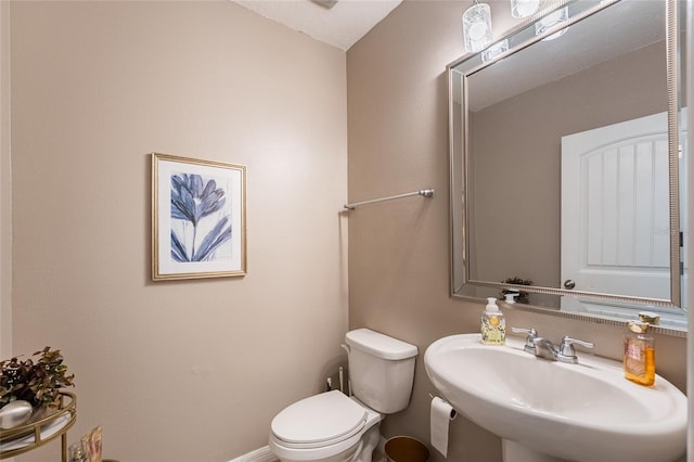 16162 Arbor Crest Aly, Winter Garden, FL 34787 - bathroom with a sink, toilet, and baseboards