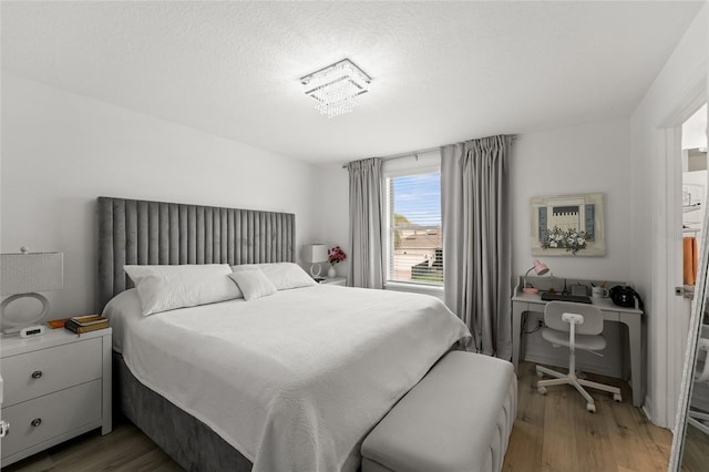 16162 Arbor Crest Aly, Winter Garden, FL 34787 - bedroom featuring light wood-type flooring and a textured ceiling
