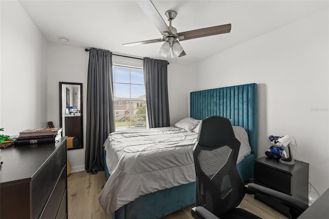 16162 Arbor Crest Aly, Winter Garden, FL 34787 - bedroom featuring light wood-style floors, a ceiling fan, and baseboards