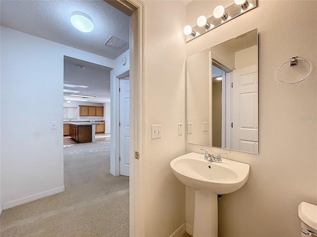 half bathroom featuring baseboards
