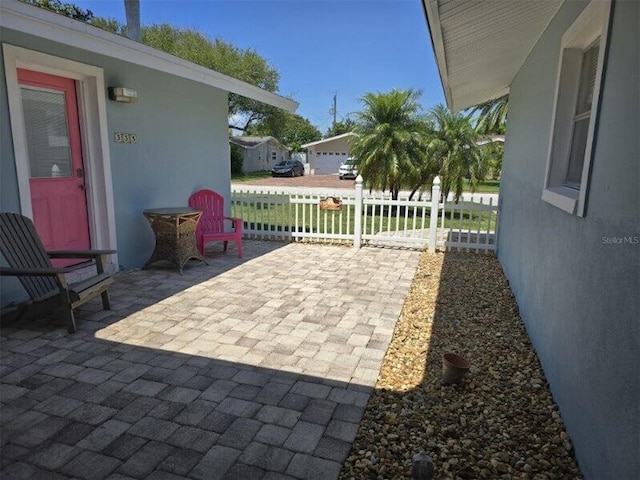 view of patio / terrace featuring fence
