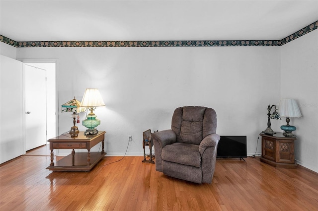 sitting room featuring wood finished floors and baseboards