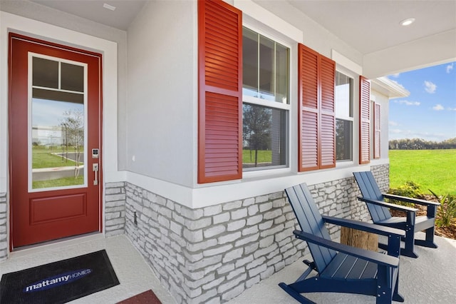 2681 Ginseng Ivy St, Apopka, FL 32703 - doorway to property featuring a porch and stone siding