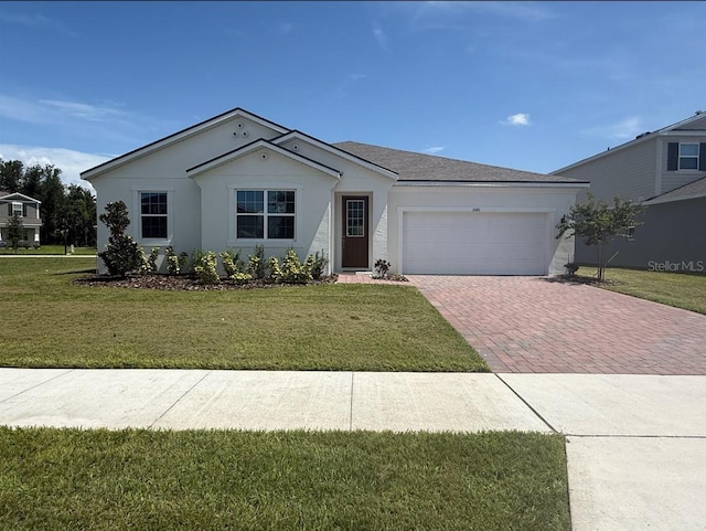 2681 Ginseng Ivy St, Apopka, FL 32703 - single story home featuring decorative driveway, an attached garage, a front yard, and stucco siding