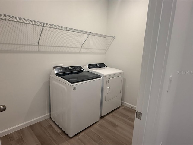 2681 Ginseng Ivy St, Apopka, FL 32703 - laundry room with washer and clothes dryer and wood finished floors
