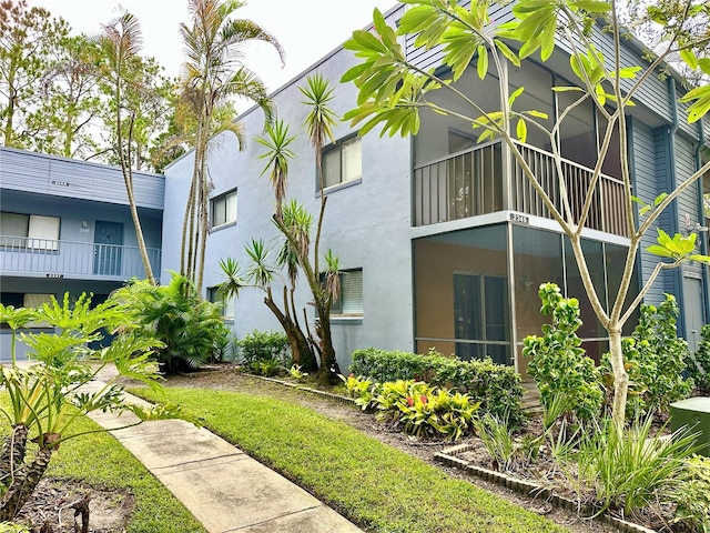 view of side of property with stucco siding
