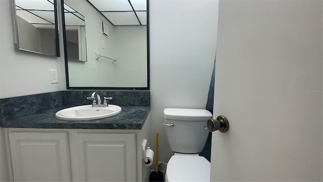 bathroom featuring toilet and vanity
