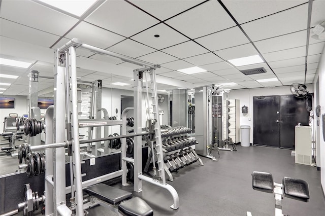 workout area with a drop ceiling