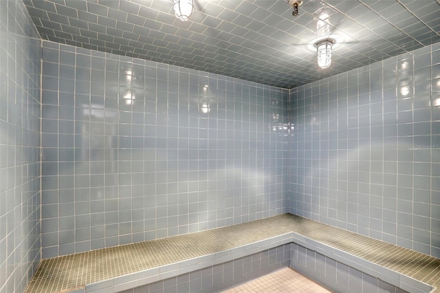 full bathroom featuring tiled shower
