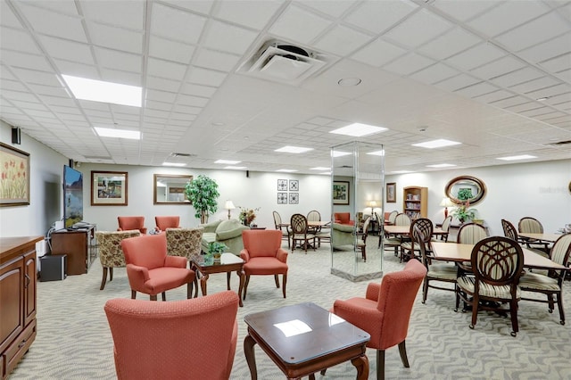 community lobby featuring a drop ceiling