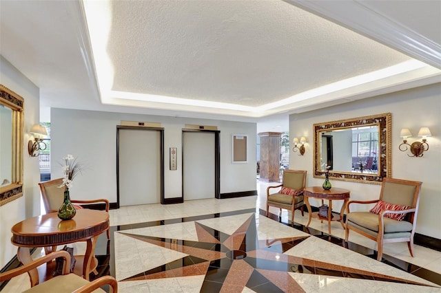 building lobby featuring a textured ceiling