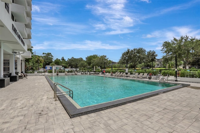 community pool with a patio