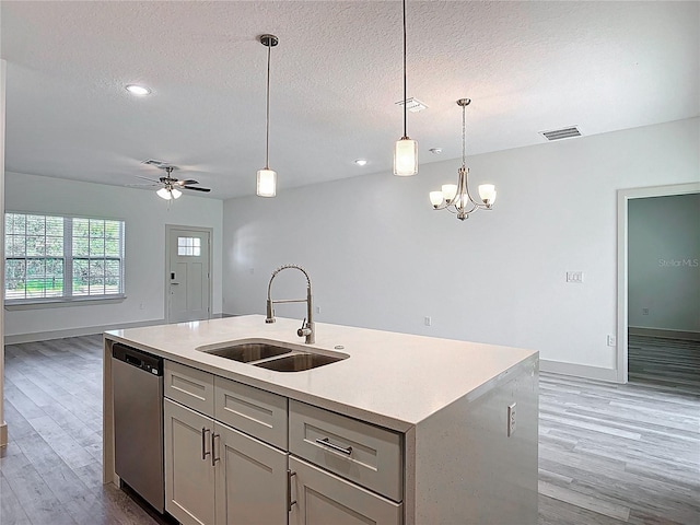 16253 SW 29th Court Rd, Ocala, FL 34473 - kitchen featuring a sink, stainless steel dishwasher, open floor plan, wood finished floors, and light countertops