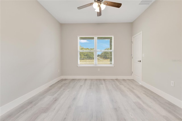unfurnished room with a ceiling fan, light wood-type flooring, and baseboards