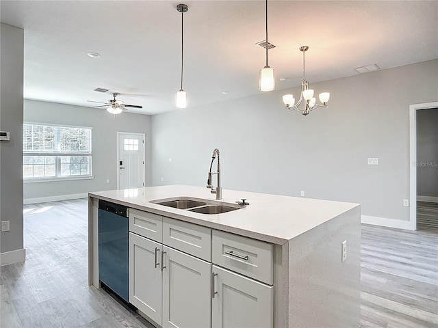 2531 SW 167th Loop, Ocala, FL 34473 - kitchen featuring a sink, dishwashing machine, baseboards, light wood-style floors, and open floor plan