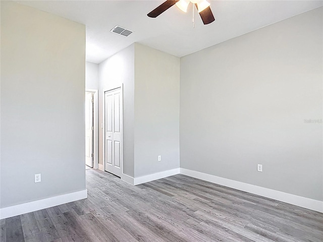 2531 SW 167th Loop, Ocala, FL 34473 - empty room featuring ceiling fan, wood finished floors, and baseboards
