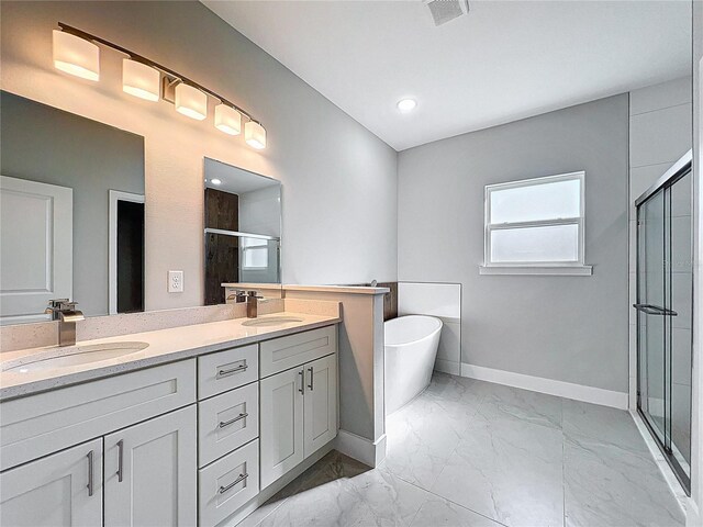 2531 SW 167th Loop, Ocala, FL 34473 - bathroom with a stall shower, marble look tile flooring, baseboards, double vanity, and a freestanding bath