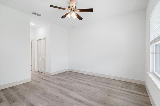 spare room with ceiling fan, plenty of natural light, light wood finished floors, and recessed lighting