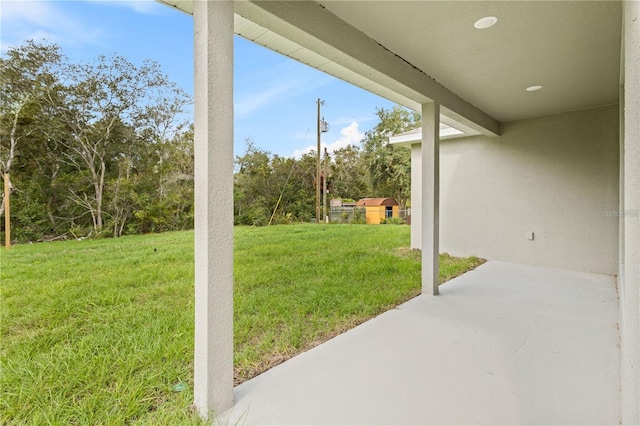 view of grassy yard featuring a patio