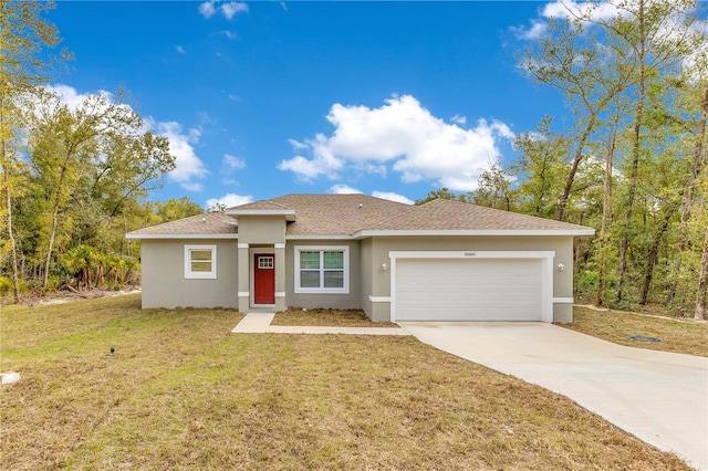 view of front of house with stucco siding, an attached garage, driveway, a front yard, and roof with shingles