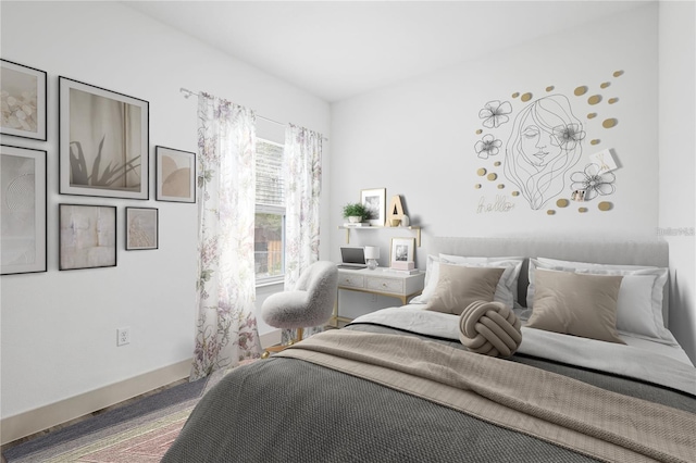 bedroom featuring baseboards