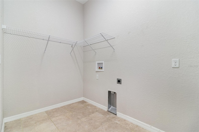 clothes washing area featuring electric dryer hookup, washer hookup, and baseboards