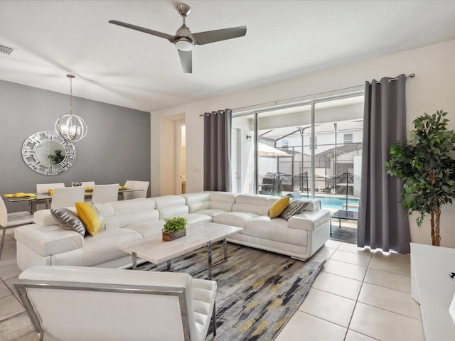 1632 Tropical Palms Cir, Kissimmee, FL 34747 - living area with a chandelier, ceiling fan, and light tile patterned floors