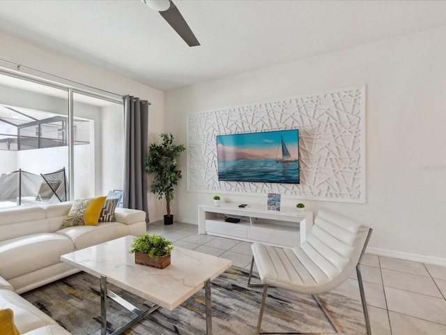 1632 Tropical Palms Cir, Kissimmee, FL 34747 - living room with light tile patterned floors, ceiling fan, and baseboards