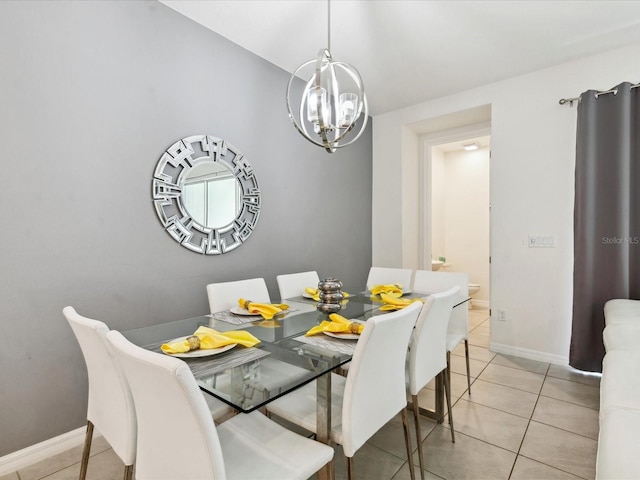 1632 Tropical Palms Cir, Kissimmee, FL 34747 - dining space featuring a chandelier, light tile patterned flooring, and baseboards