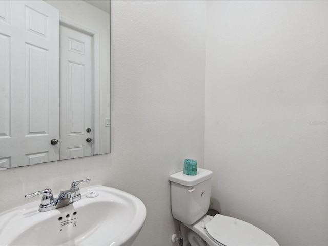 1632 Tropical Palms Cir, Kissimmee, FL 34747 - bathroom featuring a sink and toilet