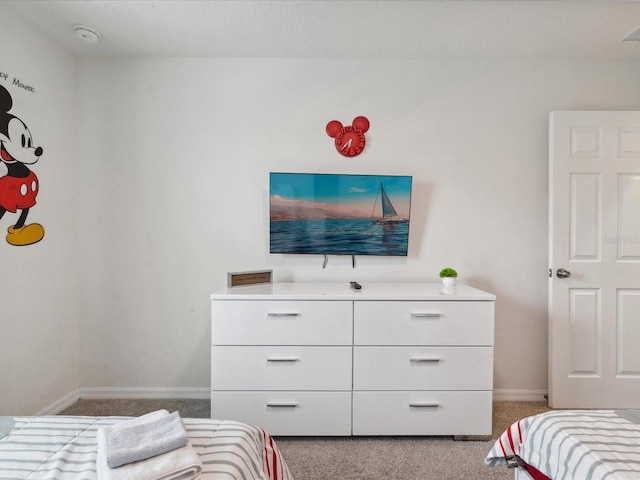 1632 Tropical Palms Cir, Kissimmee, FL 34747 - bedroom with light carpet and baseboards