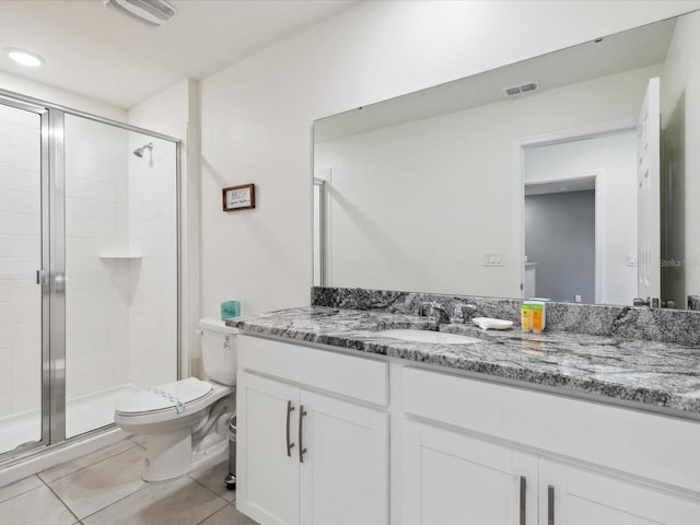 1632 Tropical Palms Cir, Kissimmee, FL 34747 - full bathroom featuring a stall shower, toilet, vanity, and tile patterned flooring