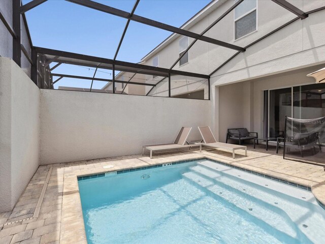 1632 Tropical Palms Cir, Kissimmee, FL 34747 - outdoor pool with a patio area and a lanai