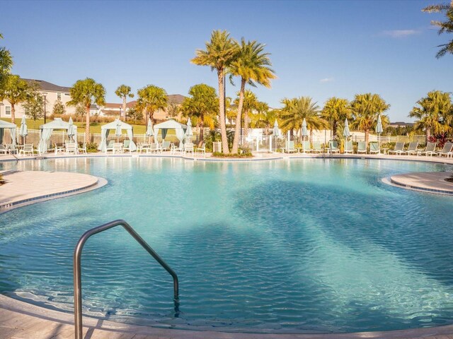 1632 Tropical Palms Cir, Kissimmee, FL 34747 - community pool with a patio area