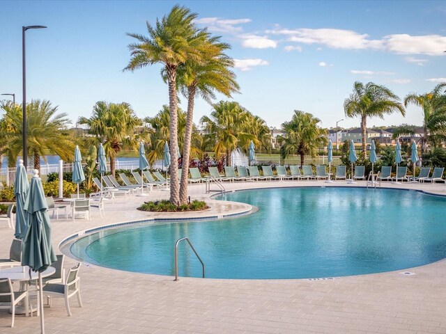 1632 Tropical Palms Cir, Kissimmee, FL 34747 - community pool with a patio