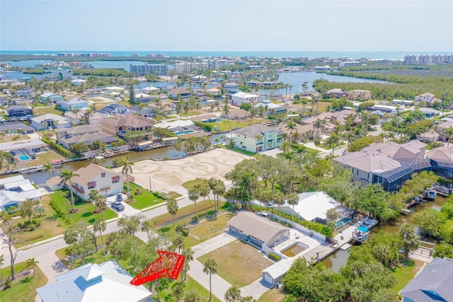 4838 Tarpon Ave, Bonita Springs, FL 34134 - aerial view of property and surrounding area featuring a nearby body of water and nearby suburban area