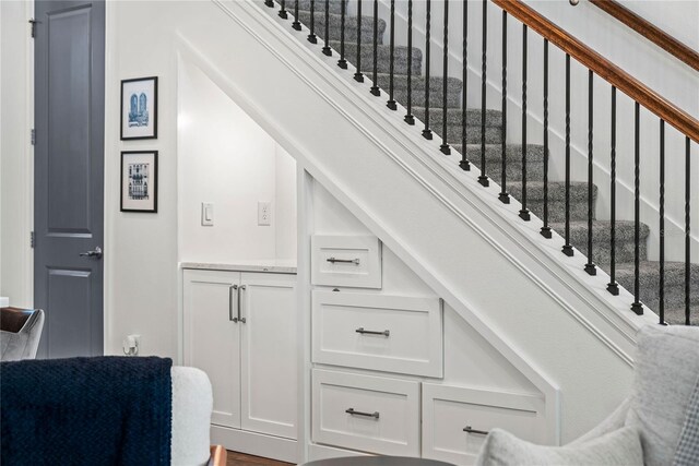 staircase with wood finished floors