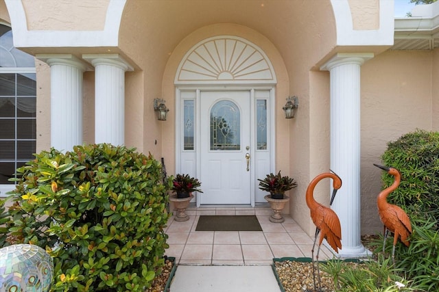 property entrance with stucco siding