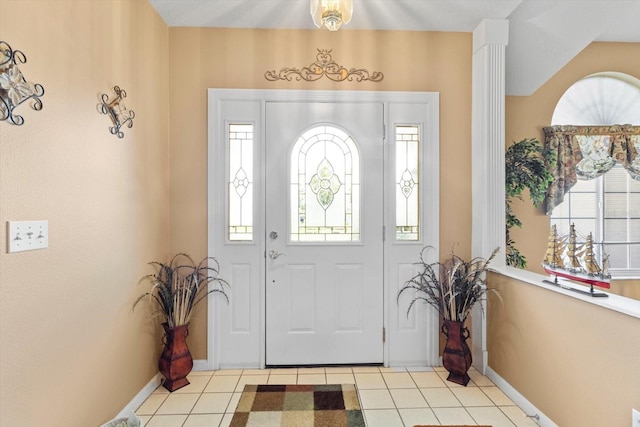 tiled foyer entrance featuring healthy amount of natural light and baseboards