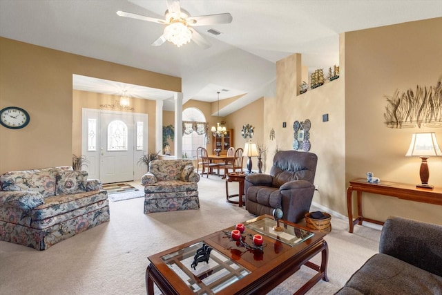 carpeted living room featuring a chandelier, ceiling fan, lofted ceiling, and baseboards