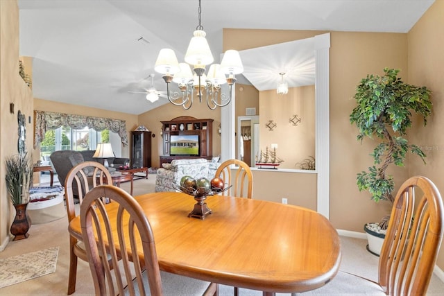 dining room featuring light colored carpet, a chandelier, vaulted ceiling, and baseboards