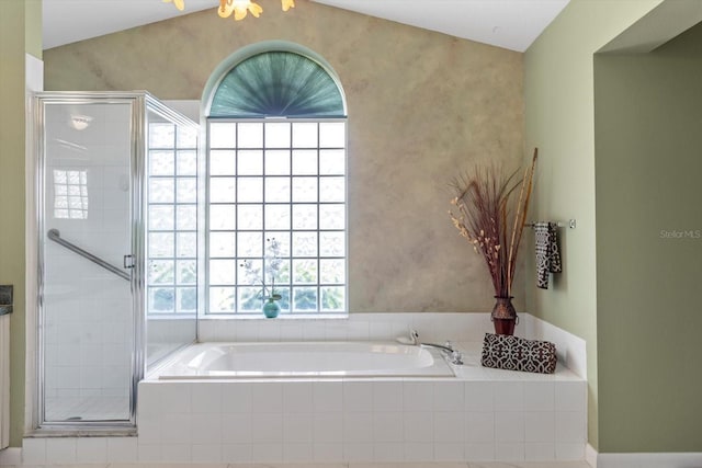 bathroom featuring a shower stall and a garden tub