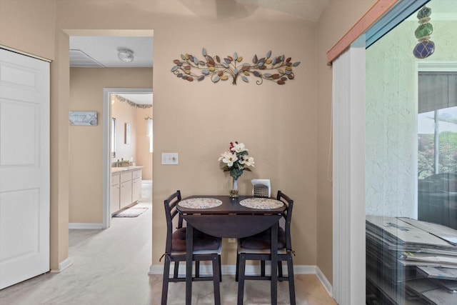 dining space with baseboards