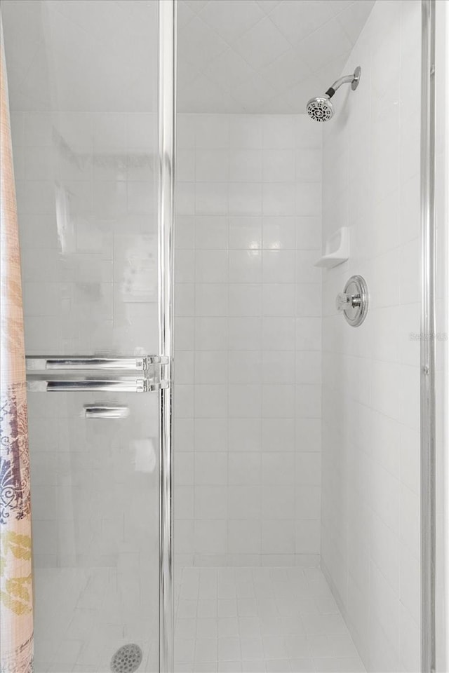 full bath with a shower stall