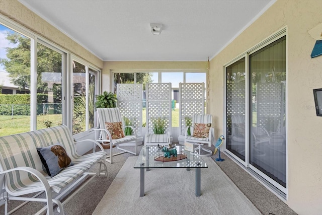 sunroom featuring an outdoor living space