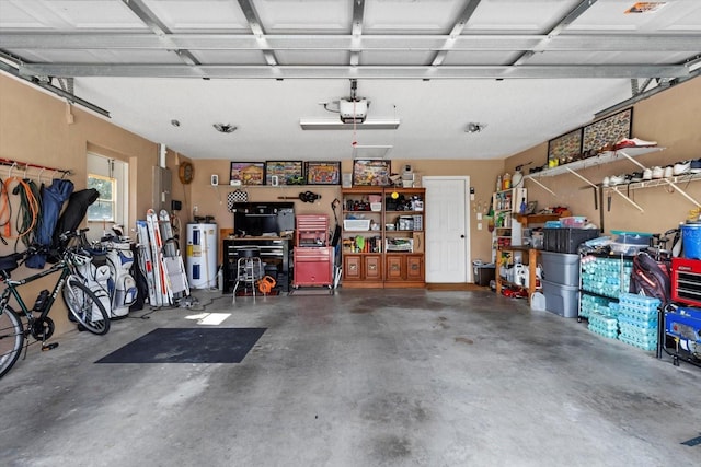 garage featuring water heater and a garage door opener